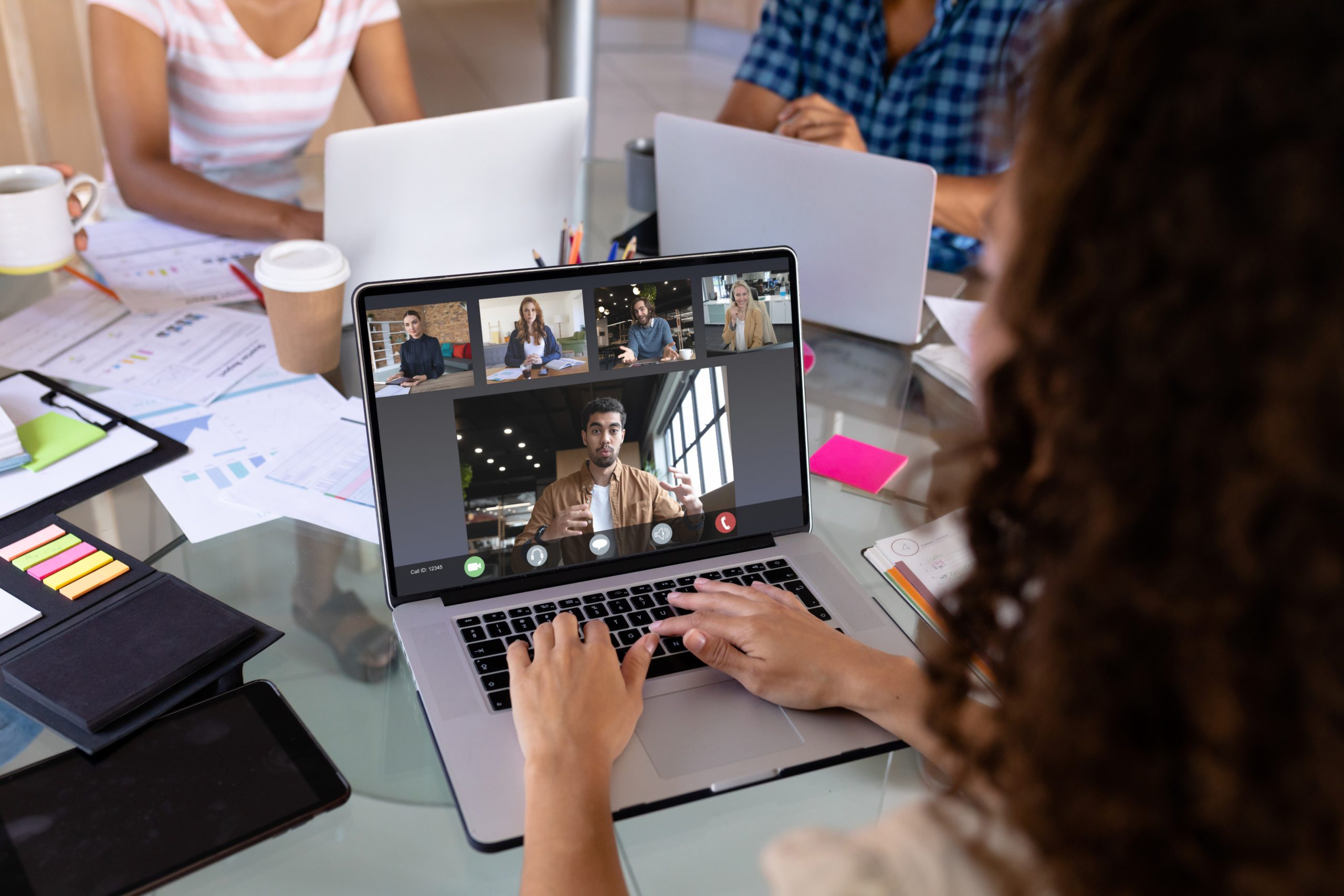 Woman meeting virtually with coworkers