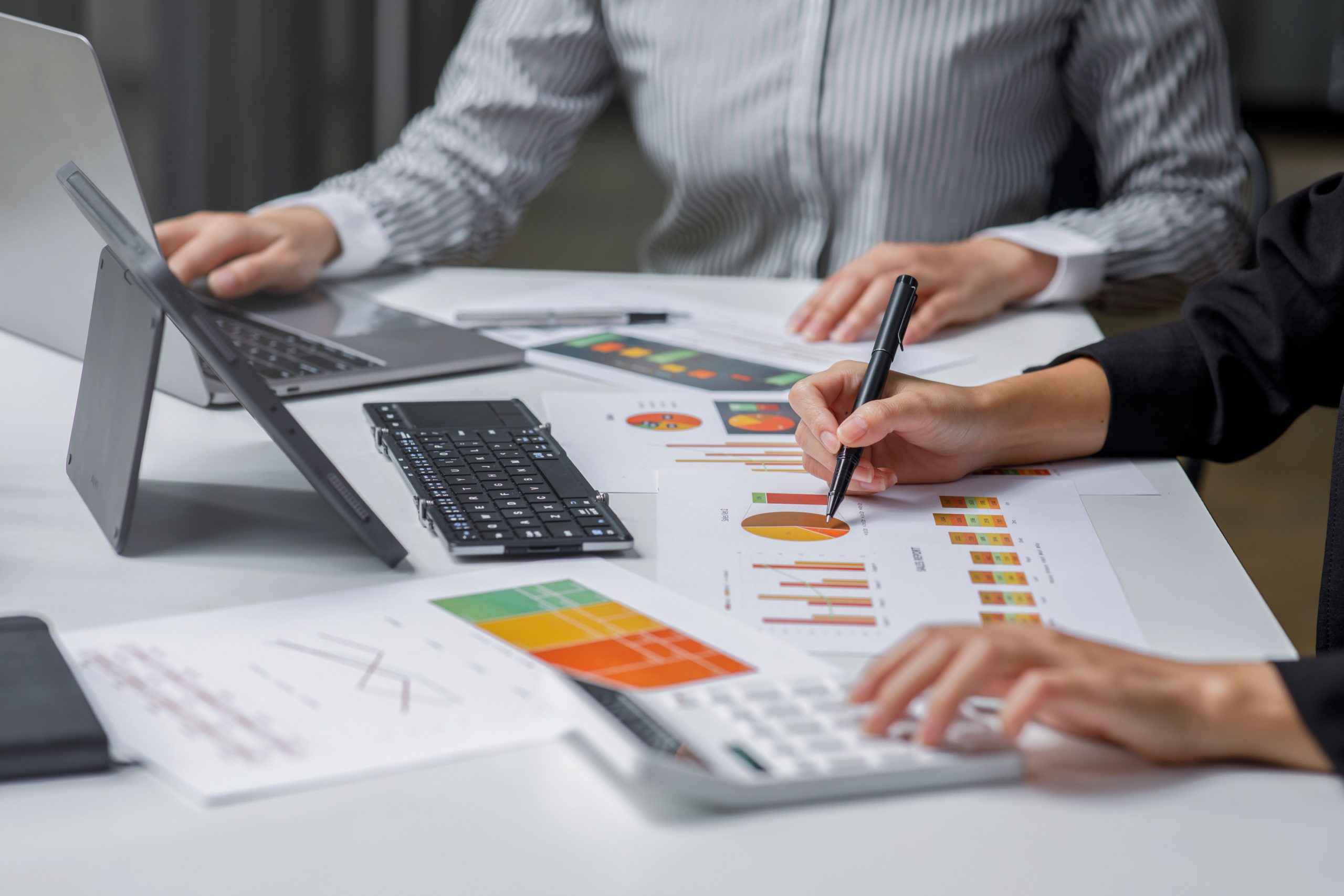 People working on charts and data