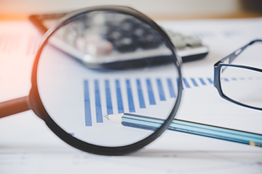 charts and graphs with magnifying glass and pencil, calculator, charts and graphs with magnifying glass and pencil, calculator,