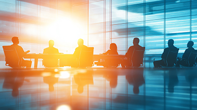 Minimalist Conference Room with Discussion on Risk Mitigation A minimalist conference room featuring silhouettes of professionals engaged in a serious discussion about risk mitigation. The bright lighting enhances the modern aesthetic.