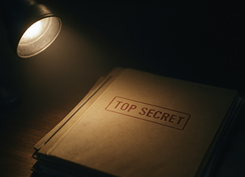 dimly lit scene features stack of files with TOP SECRET label, emphasizing need to stop corruption and protect sensitive information A dimly lit scene features stack of files with TOP SECRET label, emphasizing need to stop corruption and protect sensitive information